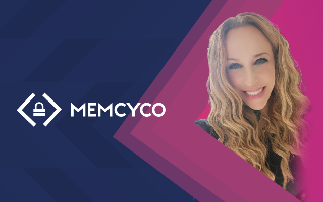 A woman with long, wavy blonde hair is smiling. Shira Rubinoff stands before a blue and pink geometric background featuring the Memcyco logo and name.